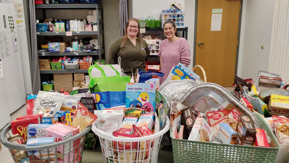 TCT's Jackie Litts donates Thanksgiving baskets to CAPTAIN Community Human Services