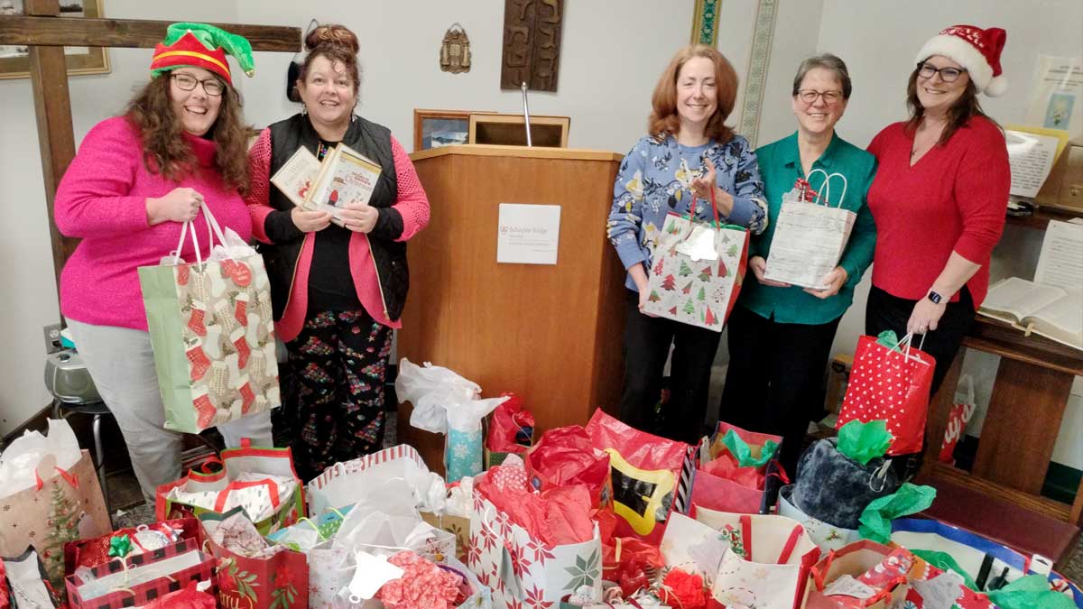 TCT' Sherry Bischoff and Debbie Reynolds donate gifts from TCT Members to nursing homes.