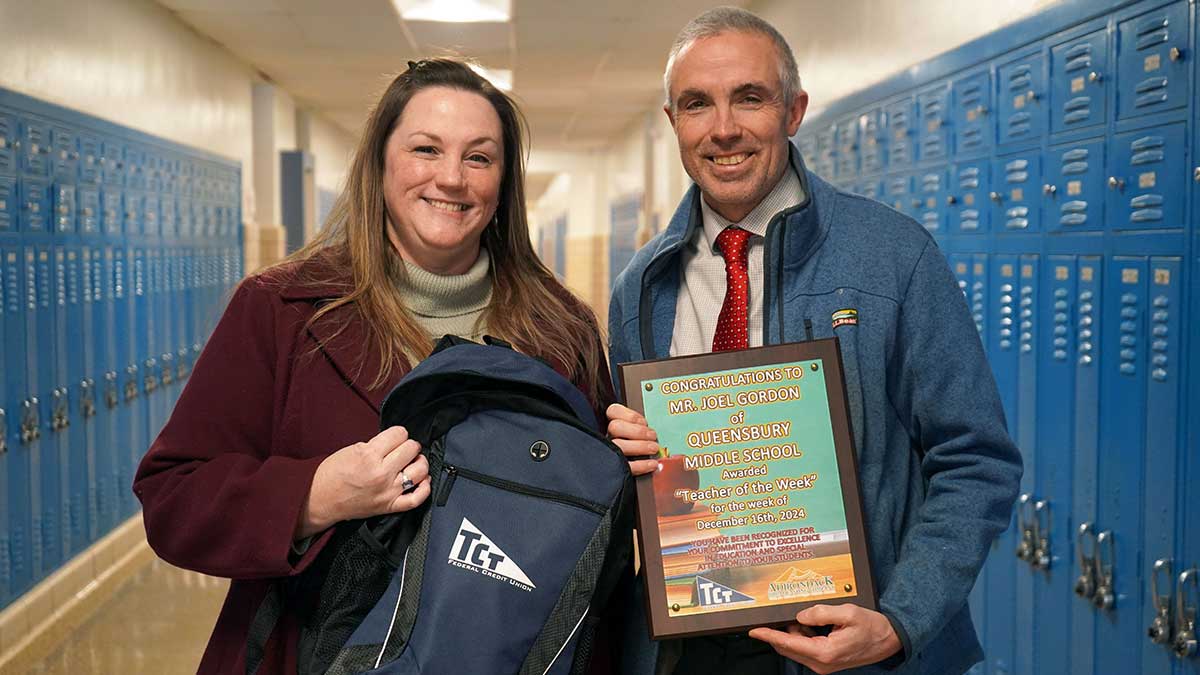 Jeannie Dickinson presents award to Joel Gordon, Special Education Teacher at Queensbury Middle School